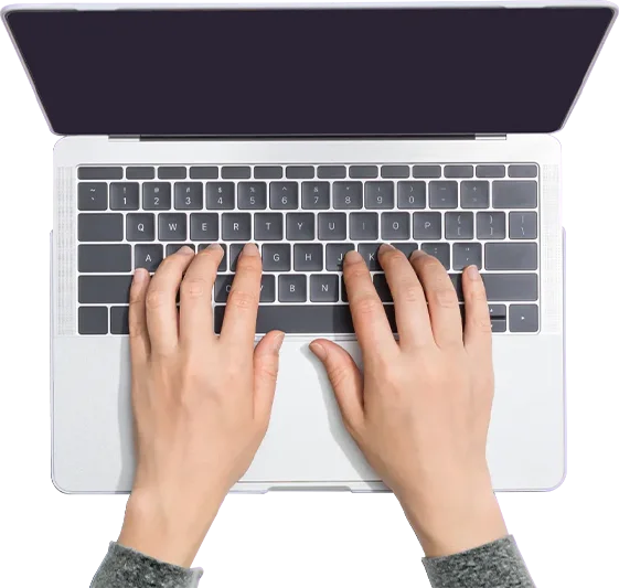 hands on a laptop keyboard
